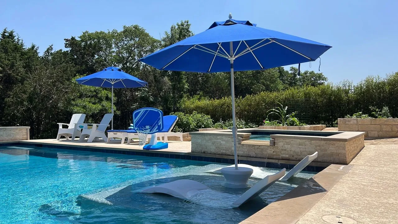 Austin pool renovation technician resurfacing a residential pool